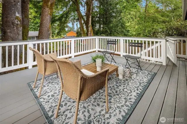 Outdoor entertaining on the deck accessed between dining and kitchen