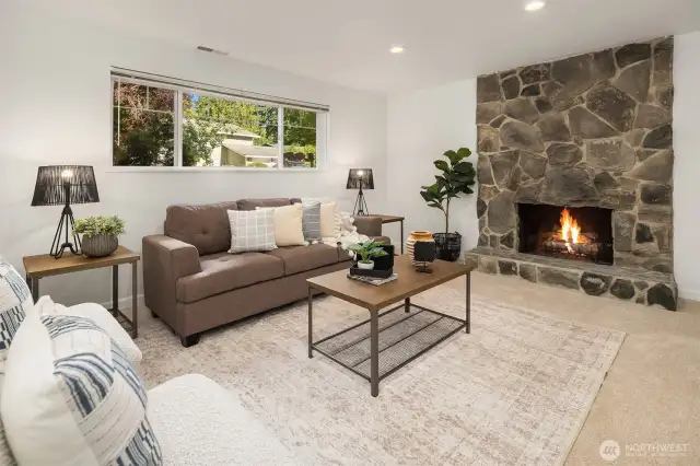 Lower living room w/wood fireplace