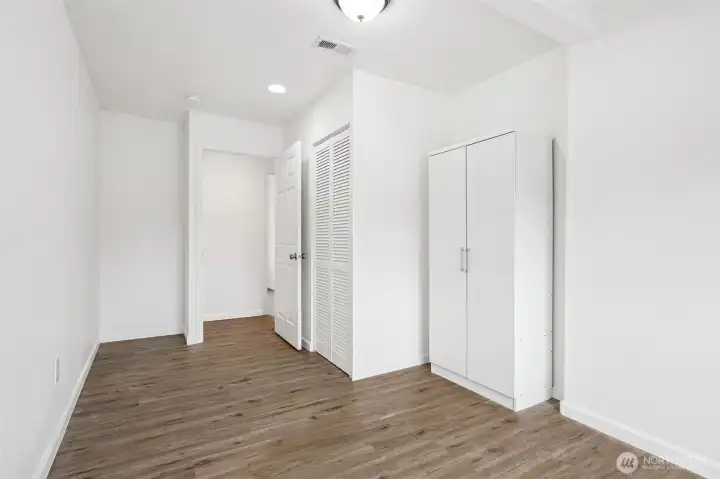 The second view of this 17-foot room proves it’s not a trick of the camera. With shutter closet doors and space that can flex from a bedroom to a family hangout, you can make this feel like a studio suite for multigenerational living, if needed. Flexiblity galore!