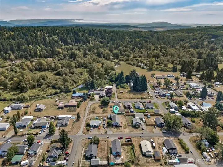 From above, you see Bucoda’s edge-of-town setting, surrounded by trees and just minutes from everything you need. Tenino is five minutes north with antique shops, Saturday farmers markets, and the Tenino Quarry Pool in summer. Grand Mound is ten minutes west with I-5 access, Great Wolf Lodge, brewery, and plenty of shopping and dining.