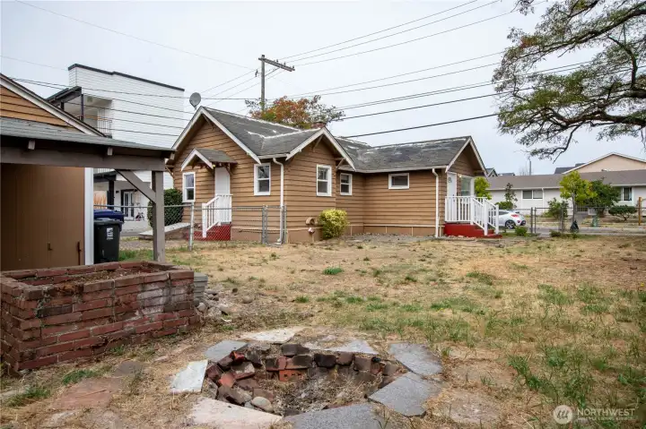 View from rear yard. Enjoy your evening aroud the firepit and BBQ under the covered patio,