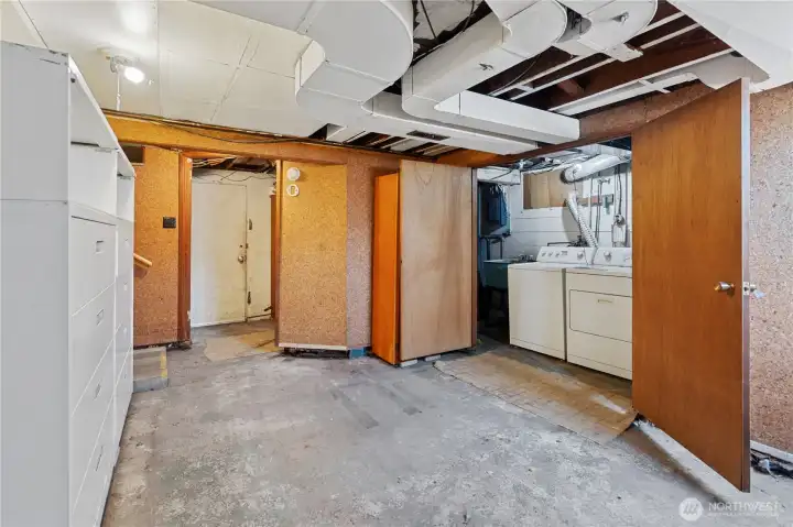 Utility room in basement with newer 2024 water heater.