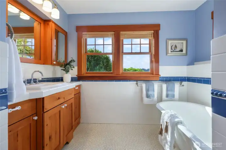 Primary full bathroom with clawfoot tub. Shower is to the right of the photo.