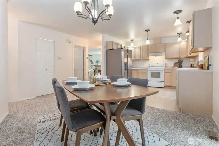 Dining off kitchen, yet can see through to living room. Walk-in pantry through door