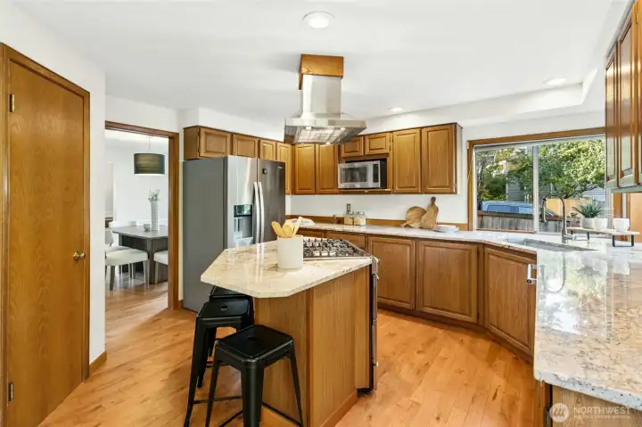 Island serves as the perfect breakfast bar, whil the pantry behind allows for ample food storage.