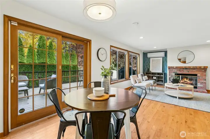 Move from the breakfast area back to the family room. Exposed brick gas fireplace adds warmth to the space.