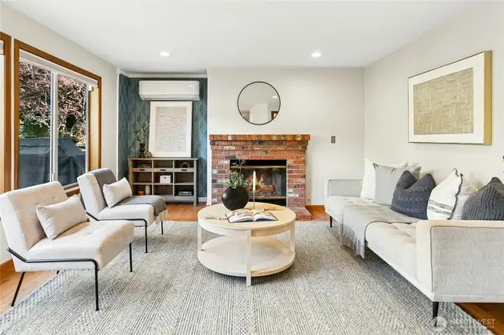 Relax before the fire, and enjoy the added designer wallpaper in the recessed nook.