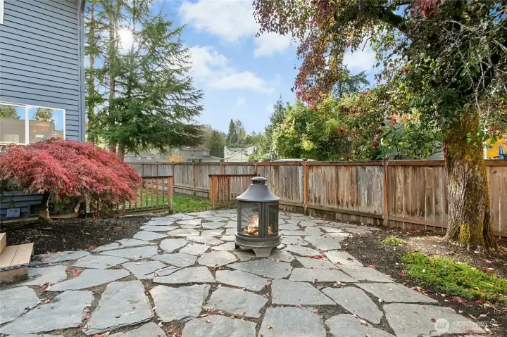 Cozy up next to a firepit, grill, or lounge away under the shade of a tree. Get to the side yard through the gate in fornt of you, or access the deck on your left.