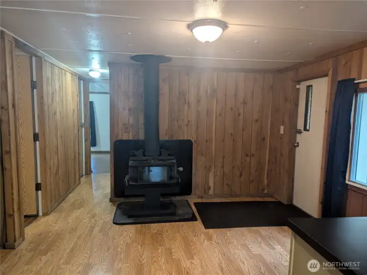 Wood stove area a few swivel chairs and a table would be perfect here.