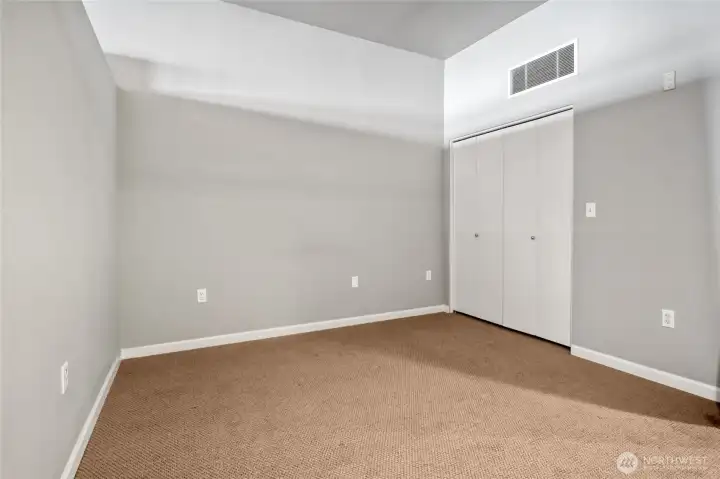 Dual doors conceal the walk-in closet.