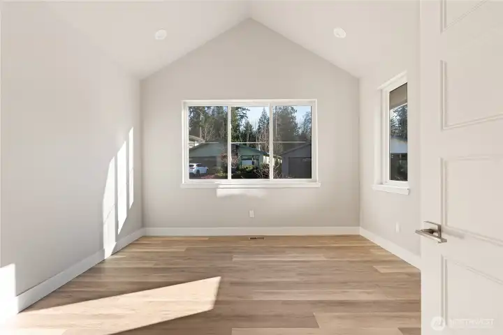 A vaulted private office on the first floor with lots of natural light, and privacy French doors. Or can be used as a reading nook/library, morning fitness or yoga room...