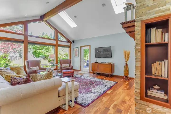 Living room with vaulted ceilings, floor to ceiling windows, skylights and private door to lovely, private deck with gorgeous seasonal mountain views. Living room with vaulted ceilings, floor to ceiling windows, skylights and private door to lovely, private deck with gorgeous seasonal mountain views.