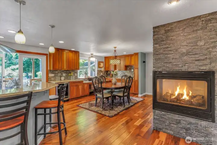 Great open floorplan with dining area and corner gas fireplace. Beverage fridge, efficient work area, wet bar. Great open floorplan with dining area and corner gas fireplace. Beverage fridge, efficient work area, wet bar.