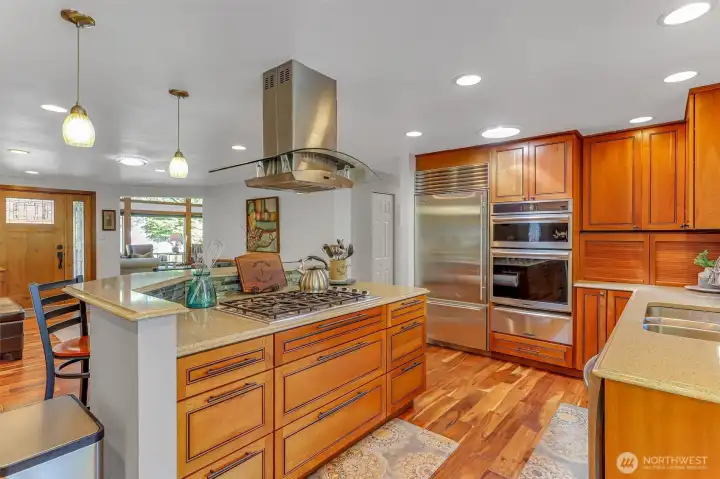 Kitchen with custom cabinets include appliance cubbies, large pulls, and Zodiaq quartz counters. Kitchen with custom cabinets include appliance cubbies, large pulls, and Zodiaq quartz counters.