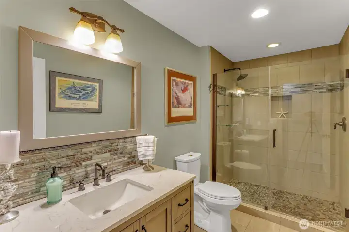 3/4 custom bathroom behind the dining area. Quartz counters, tile floors, custom shower. 3/4 custom bathroom behind the dining area. Quartz counters, tile floors, custom shower.