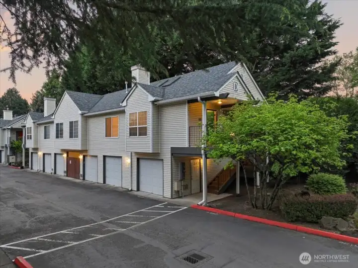 Exterior, garage, covered stairs & entrance via covered balcony
