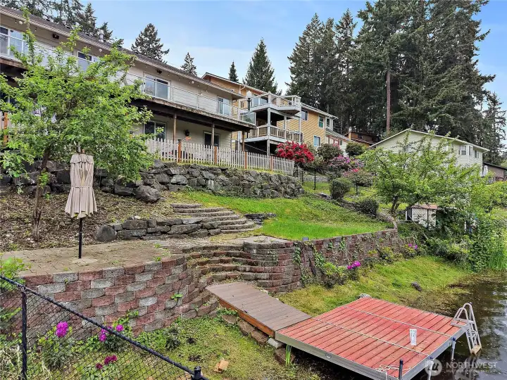 Tiered backyard with lake access