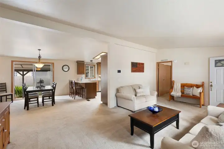 From the living room, you stroll into the dining area and access to the covered patio.