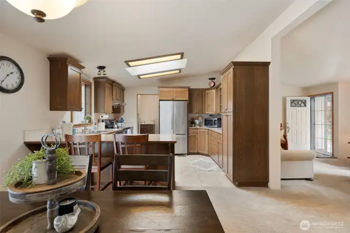 From the Dining Area, and looking to the kitchen.  All kitchen appliances stay with the home.