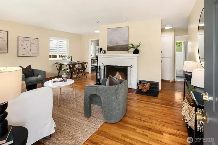 The spacious living room is bathed in natural light and no carpet anywhere.