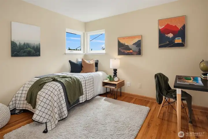 The second bedroom is nice sized with room for a bed and office area.