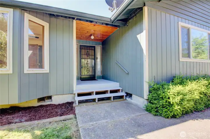 Front entrance with newly painted covered porch. Front entrance with newly painted covered porch.