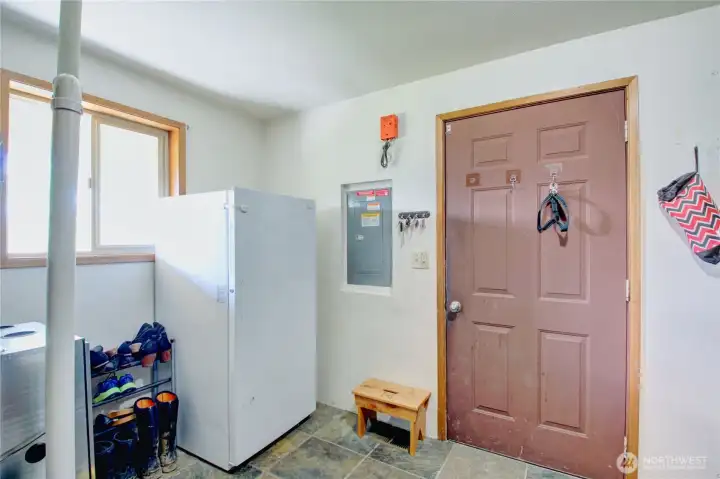 Mudroom with door to side porch leading to shop. Mudroom with door to side porch leading to shop.