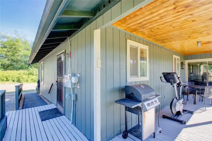 South facing covered back porch with exterior lighting. South facing covered back porch with exterior lighting.