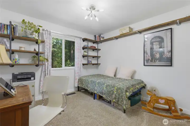 Upstairs guest bedroom #1 with shelving installed already for you. Upstairs guest bedroom #1 with shelving installed already for you.