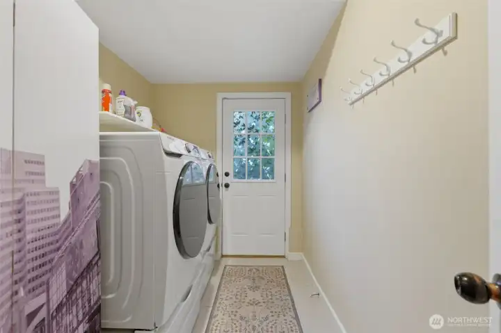 Downstairs laundry room with access to the backyard. Downstairs laundry room with access to the backyard.
