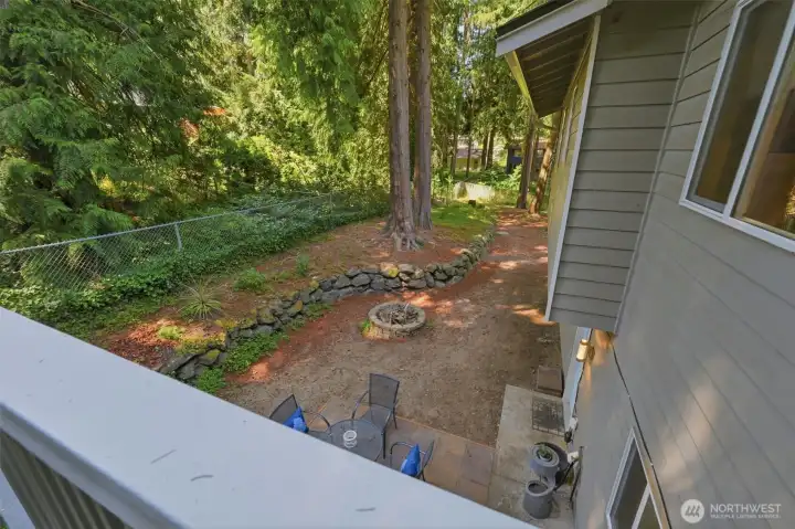 The view to the lower backyard from the deck. The view to the lower backyard from the deck.