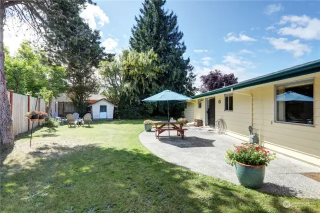 Large fenced in yard with oversized patio for picnic table, BBQ, hot tub and more. Great place for entertaining.
