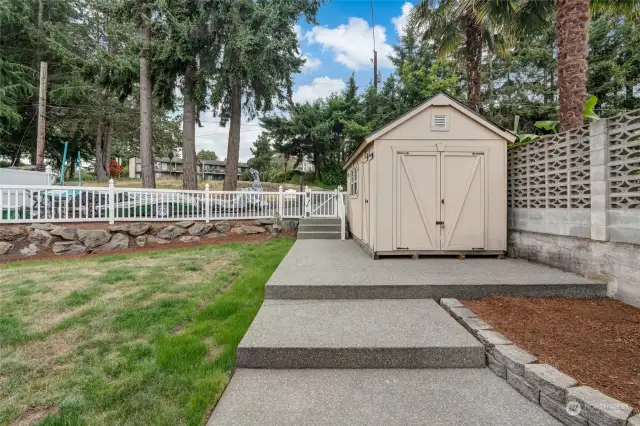 Front yard area, with storage shed.