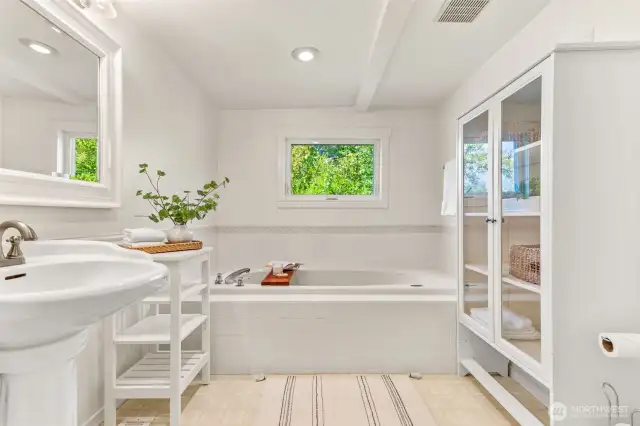 Spacious and delightful, this primary bath also has loads of storage!