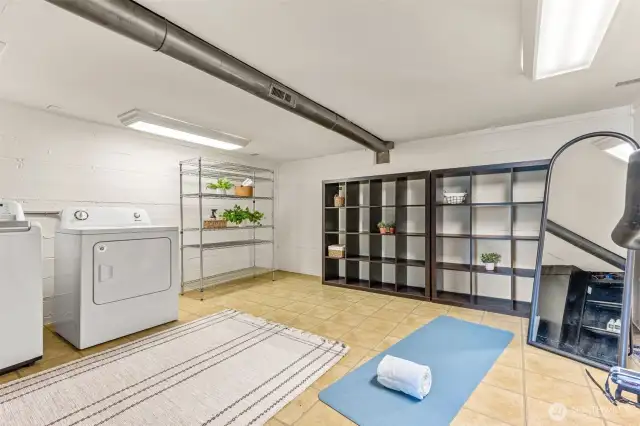 The laundry room on a waterfront home needs to be spacious and welcoming! No tiny laundry or stacked machines for this home! Need to hang wetsuits and lifejackets to dry?  Want to store bikes, or display exercise equipment?  No problem! We've got a ton of room!