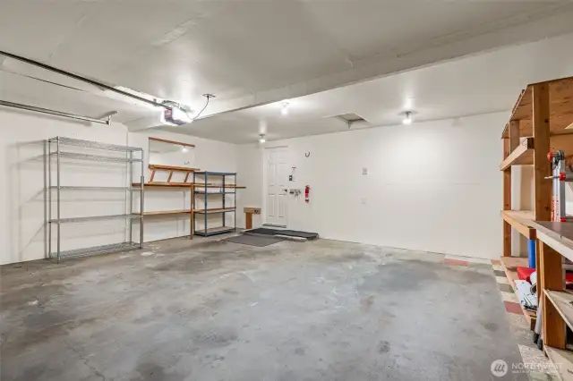 The home's regular garage is spacious, freshly painted and includes tons of shelving.