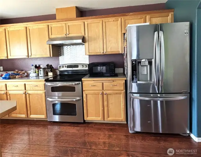 Kitchen with double-oven, stainless-steel appliances
