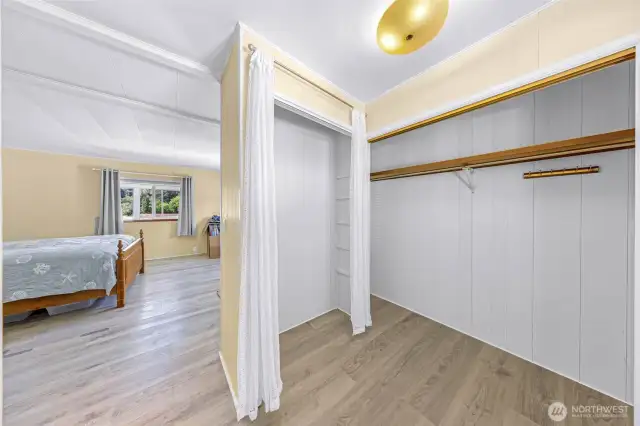 Primary bedroom dressing area with 2 closets