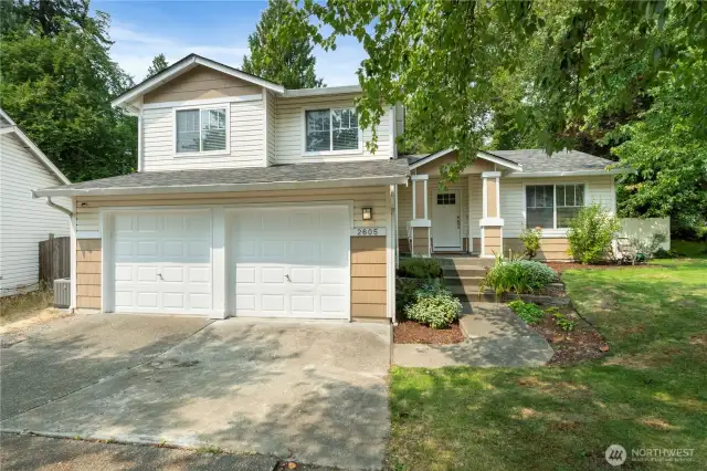 Front Exterior  Welcome home! Beautiful curb appeal with manicured landscaping and a charming front entry. Two car garage