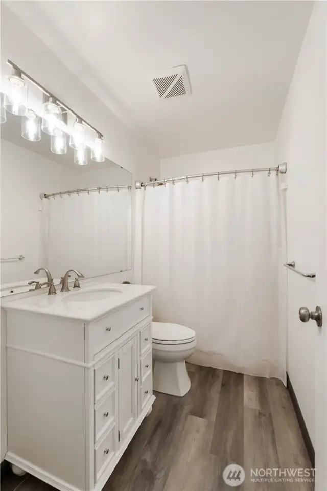 Upstairs hall bathroom.    Well-appointed second bathroom with a clean, modern feel.
