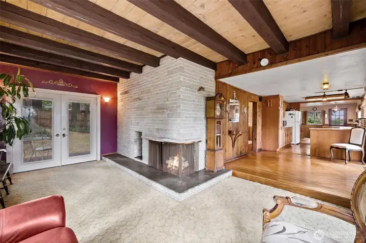 Mid-mod vibes in Living Room. French Doors to deck