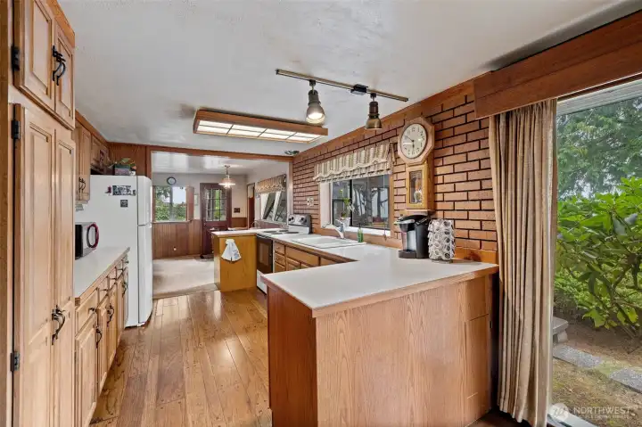 Cute and functional kitchen with garden window.