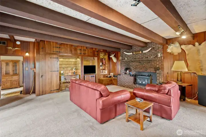 Fun and homey Family Room with natural wood accents and exposed beams