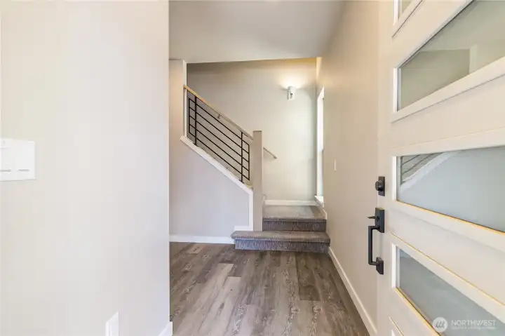 Spacious entry with stairs leading to upstairs bedrooms