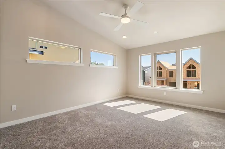 Upstairs primary suite with lots of natural light