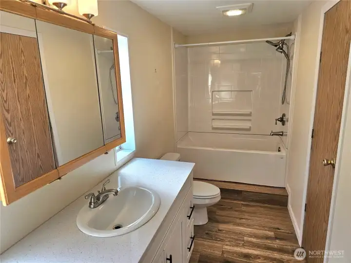 Full Primary Bath new flooring and quartz vanity! Linen closet and deep soaking tub