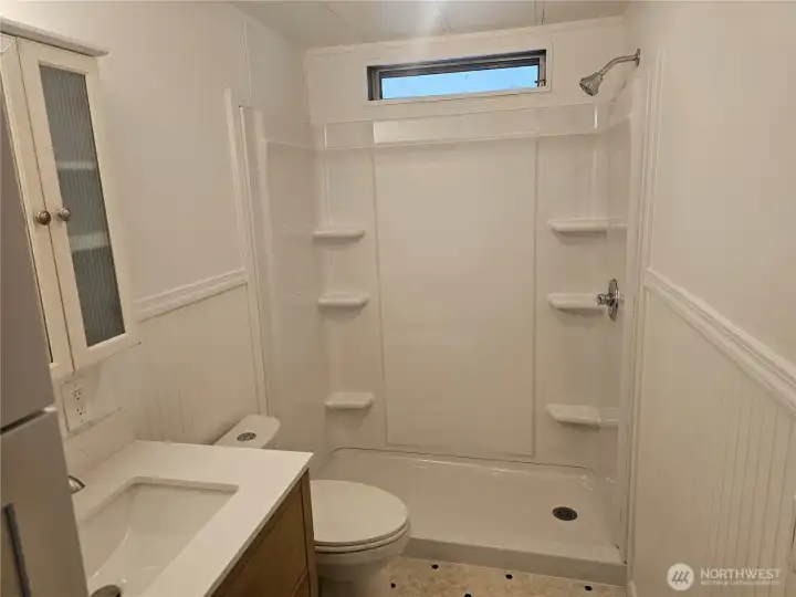 Guest bath with new walk in shower and quartz vanity