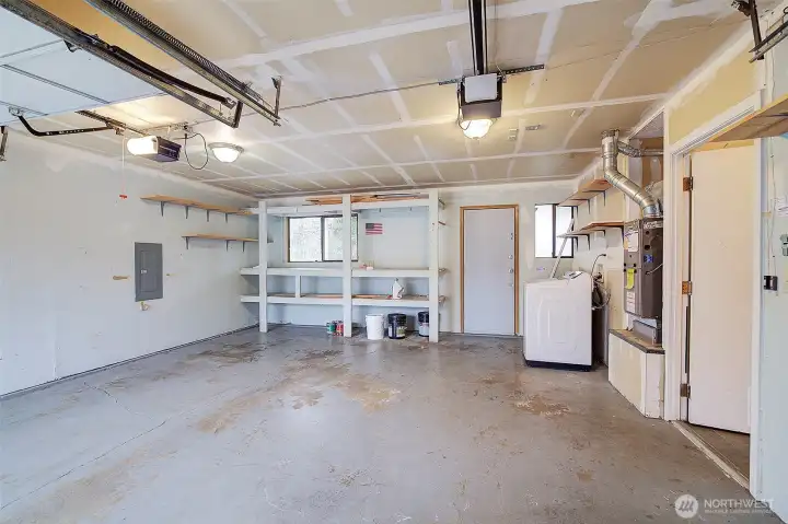 Roomy garage with storage shelves.