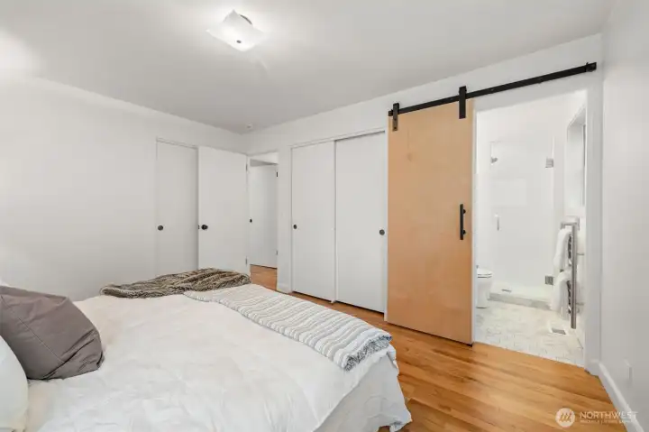 Private primary retreat with direct access to the fully remodeled ensuite bath. Thoughtful layout and streamlined finishes create a refined, move-in-ready experience.