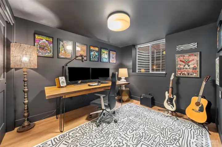 Lower-level Bedroom Four offers privacy and flexibility, ideal for a guest suite, media room, or dedicated home office within the permitted ADU.